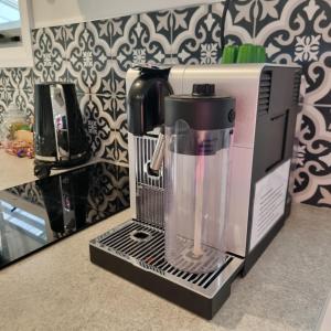 a blender sitting on top of a kitchen counter at Kadi House - Unit 2 in Wynyard +20 photos