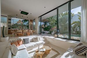 a living room with a couch and a table at Casa Noema in Kerobokan +23 photos