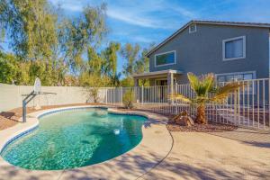 a house with a swimming pool in front of a house at Game Room Pool King bed Pool Table in Peoria