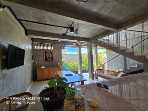 a living room with a table and a dining room at Prime Location Villa Berawa Canggu 3bed in Canggu
