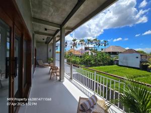 a balcony with a view of the ocean at Prime Location Villa Berawa Canggu 3bed in Canggu