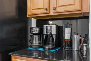a coffee maker on a counter in a kitchen at Family Friendly w Badminton Goodyear Park in Goodyear +22 photos