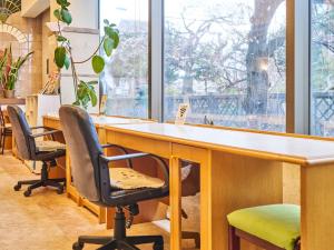 an office with two chairs and a large window at Hotel Fukui Castle - Vacation STAY 58709v in Fukui +66 photos