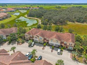 an aerial view of a house with a lot of cars at 4 Bedrooms 35 Bathrooms Solterra 4751 Td in Davenport
