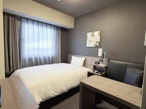 Letto o letti in una camera di Hotel Route Inn Noda -Kokudo 16 Gouzoi-