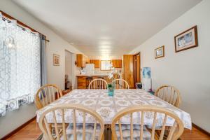 a dining room with a table and chairs at 2 Mi to Hawaii Volcanoes Natl Park Tranquil Home in Volcano +18 photos