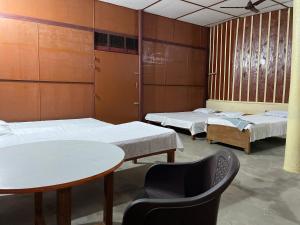 Postel nebo postele na pokoji v ubytování Mousak Lodge