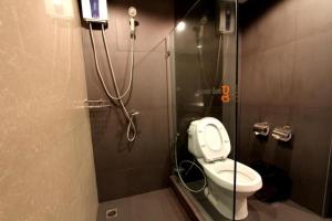 a shower stall with a toilet in a bathroom at The Regent Ubon in Ban Na Khwai +102 photos