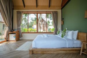 Postel nebo postele na pokoji v ubytování Moana Resort Koh Kood