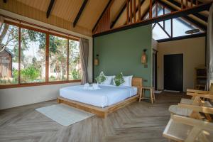 Postel nebo postele na pokoji v ubytování Moana Resort Koh Kood
