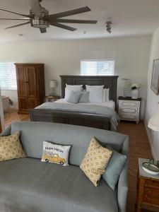 a living room with a couch and a bed at Rustic Ridge Vineyards Cottage in Jamul