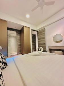 Postel nebo postele na pokoji v ubytování Agile Luxury Suite At TRX KLCC