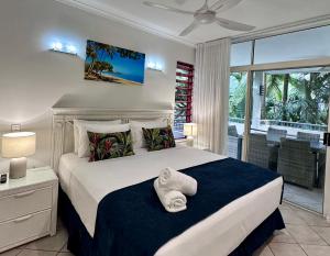 Postel nebo postele na pokoji v ubytování Oasis at Palm Cove + 37 fotografií