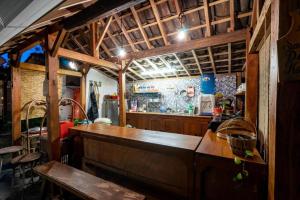 a bar with a wooden counter in a restaurant at Hotel O Putroyono Homestay in Mendut
