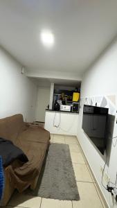 TV a/nebo společenská místnost v ubytování Quarto aconchegante em -AP Compartilhado, Próximo do Parque Do Povo