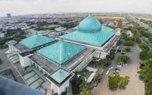 an overhead view of a building with a blue roof at OYO Life 2982 Griya Aisyah Residence 2 in Kedurus
