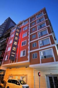 a building with a car parked in front of it at London Hotel in Macau