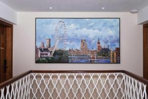 a painting of the london skyline on a wall at London Hotel in Macau