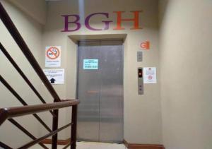 an elevator in a building with a sign on the wall at BANGI GATEWAY HOTEL in Kuala Lumpur +11 photos