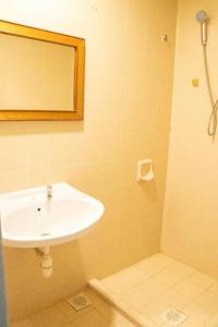 a bathroom with a sink and a shower at Hotel O Bintang Holiday in Kuala Lumpur +115 photos