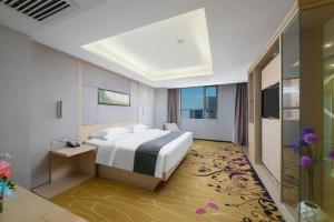 Ένα ή περισσότερα κρεβάτια σε δωμάτιο στο Lavande Hotel Changsha High-Speed Railway Station Shumuling Metro Station +187 φωτογραφίες