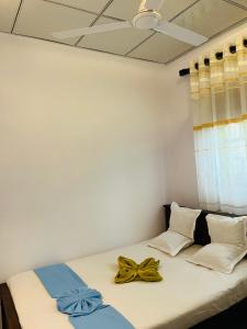 Postel nebo postele na pokoji v ubytování R Villa Unawatuna