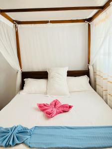 Postel nebo postele na pokoji v ubytování R Villa Unawatuna