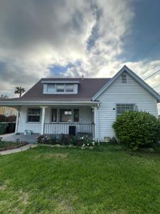 a white house with a landscaped yard at Awesome deal! Room with private bathroom close to Kia Forum, Sofi Stadium and LAX airport in Inglewood