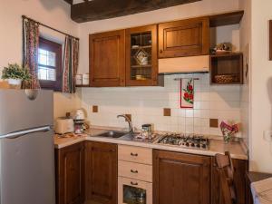 A kitchen or kitchenette at Farmhouse with air conditioning, private terrace and pool