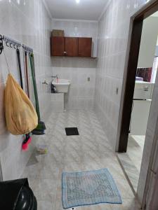 a bathroom with a shower and a sink and a toilet at Peruíbe lazer in Peruíbe +11 photos