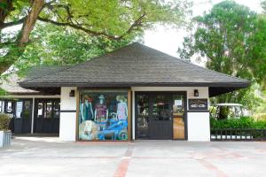a store front with a building with a painting on it at Phi Phi Holiday Resort, Leam Tong Beach in Phi Phi Islands