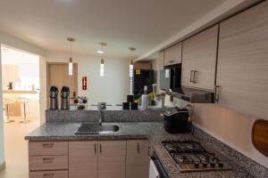 a kitchen with a sink and a counter top at Casa Mishka Hotel Boutique Habitación #105 Nuevo Cartagena in Cartagena de Indias +14 photos