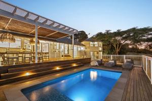 a swimming pool on the deck of a house at Meadows House & Events in Bangalow