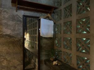 a room with a wooden door with a window at LOA Stay in Surigao