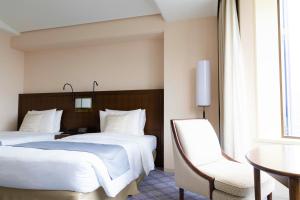 Postel nebo postele na pokoji v ubytování Imperial Hotel Tokyo