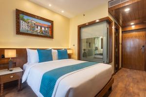 Voodi või voodid majutusasutuse Aarya Hotel and Spa toas