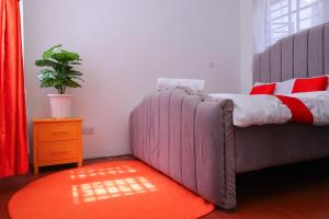 Postel nebo postele na pokoji v ubytování Blend-Inn Staycation 1 bedroom Thika town