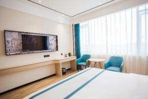 Μια τηλεόραση ή/και κέντρο ψυχαγωγίας στο City Comfort Inn Luzhou Jiangyang District Wancheng International