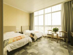 Postel nebo postele na pokoji v ubytování Shell Hotel Wuxi Jiangyin Yungu Road