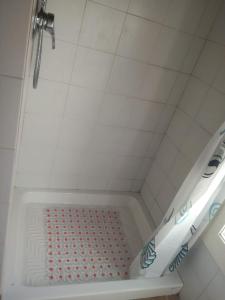 a shower with a shower head in a bathroom at Appartamento in centro con terrazza in Viareggio