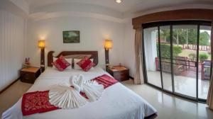 a bedroom with a bed with red and white pillows at Privacy Beach Resort & Spa in Ban Nong Khao Nieo +189 photos