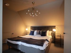 Postel nebo postele na pokoji v ubytování HAGA Hotell & Bistro