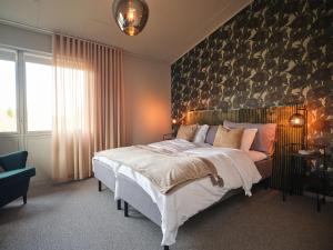 Postel nebo postele na pokoji v ubytování HAGA Hotell & Bistro