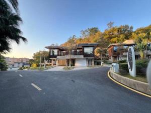 a large house on the side of a road at Xiamen SIG Resort in Tingxi
