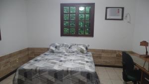 Postel nebo postele na pokoji v ubytování Quarto em casa na Mata Atlântica