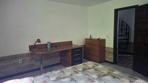 Postel nebo postele na pokoji v ubytování Quarto em casa na Mata Atlântica