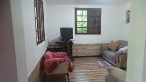 Posezení v ubytování Quarto em casa na Mata Atlântica