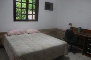 Postel nebo postele na pokoji v ubytování Quarto em casa na Mata Atlântica