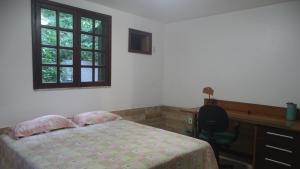 Postel nebo postele na pokoji v ubytování Quarto em casa na Mata Atlântica
