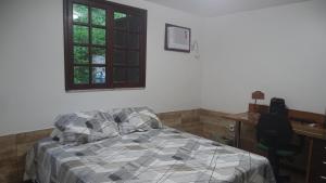 Postel nebo postele na pokoji v ubytování Quarto em casa na Mata Atlântica
